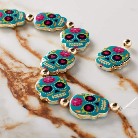 12 Packs: 7 ct. (84 total) Blue Enamel Metal Sugar Skull Beads, 20mm by Bead Landing™